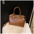 Retro brown leather handbag with buckle detail and dual handles in variant brown - Brown