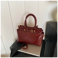 Vintage burgundy glossy leather tote bag with gold buckle straps and dual handles - Red