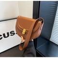 Brown leather saddle bag with golden clasp and minimalist shoulder strap design - Brown