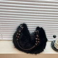 Chic black faux fur crescent handbag featuring a stylish dark brown beaded handle - Black