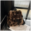 Close-up of leopard print faux fur backpack texture with drawstring and metal tips - Large Brown Leopard Print