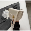 Minimalist beige saddle bag with vintage gold twist lock and smooth faux leather - Off White