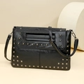 Retro black leather crossbody bag with silver square studs and minimalist strap - Black