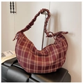 Detailed close-up of dark red checkered crescent bag with unique ruched shoulder strap - Dark Red
