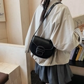 Black saddle crossbody bag with contrast white stitching and flap closure leather finish - Black