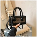 Detail of trendy crossbody bag with leopard print stitching on premium black leather - Leopard Print Black