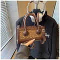 Detail of vintage leopard print handbag with leather trim and adjustable shoulder strap - Leopard Brown