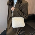 White faux fur crossbody bag featuring elegant pearl chain strap and soft plush texture - White