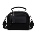 Black pebbled leather crossbody bag with wide monochrome strap and rivet tags - Black