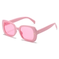 Pink square frame sunglasses with gold rivets and transparent lenses in a 45-degree view - Pink Frame / Pink Lens