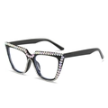 Occhiali da sole cat-eye neri con strass colorati e cristalli su sfondo bianco - Montatura nero lucido