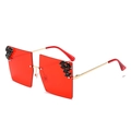 Oversized rimless sunglasses with red lenses and black rhinestones on gold metal temples - Full Red