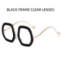 Lunettes de soleil à paillettes noires avec branches dorées et verres transparents - Monture Noire Verres Transparents
