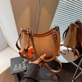 Retro canvas and leather underarm bag with a horse charm and dual straps for women - Brown