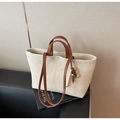 Detail of canvas tote bag with brown leather straps and wooden bead charm accessory - Off-white