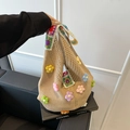 Khaki woven tote bag with colorful 3D floral accents and bohemian strap design - Khaki