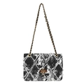Black and white acid-washed denim crossbody bag with quilted fringe and gold chain - Black
