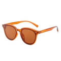 Retro round amber sunglasses with translucent brown frames and metal stud accents - Tea Frame Tea Lens