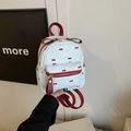 Kleiner weißer gewebter Rucksack mit roten Schleifenprints und Ledergriff - Blau
