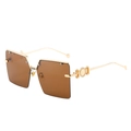 Oversized square sunglasses with gold metal frame and brown lenses in 45-degree view - Gold Frame Brown Lens