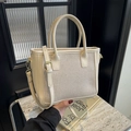 Cream woven tote bag with leather trim and gold hardware in a minimalist modern style - Off White