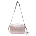 Pink PU leather crossbody bag with geometric wide strap and white plush pom-pom charm - Pink