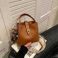 Brown leather bucket bag with wide woven strap and cute bunny pendant on the side - Brown (With Rabbit Pendant)