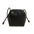 Minimalist black lychee texture trapezoid shoulder bag with elegant pleated closure detail - Black