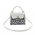 Chic white leather handbag with leopard print panel and gold twist lock closure - White