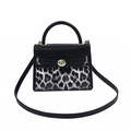 Chic leopard print and black leather crossbody bag with golden clasp and top handle - Black