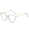 Transparent TR90 glasses with faceted clear frames and slender gold metal temples - Transparent Grey