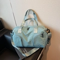 Minimalist light blue canvas travel bag with wide shoulder strap and multiple pockets - Blue