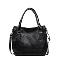 Bolso tote clásico de cuero negro con herrajes plateados y correa ajustable - Negro