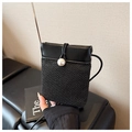 Detail of black woven straw phone bag featuring large pearl button and leather trim - Black
