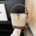 Borsa a secchiello in pelle marrone e tela con chiusura a scatto dorata e manico tondo - Marrone