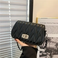 Elegant black matelassé leather crossbody bag with silver crystal buckle and chain strap - Black