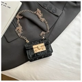Chic black crocodile embossed mini chain bag with gold metal lock on grey blazer - Black