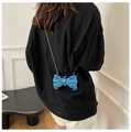 Detail of blue bow-shaped metallic hard shell mini bag with a fine gold chain strap - Blue
