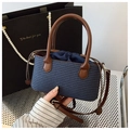 Blue handwoven straw handbag with brown leather handle and drawstring inner pouch - Blue