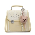 Pale yellow leather handbag with crystal embellishments and a teddy bear charm - Yellow