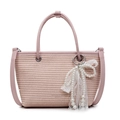Pink woven straw handbag with pearl lace bow charm and crossbody leather strap - Pink