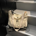 Creamy beige nylon crossbody bag with wide shoulder strap and black buckle closure - Off White