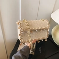 Beige woven straw flap bag with shell charms and gold metal chain strap for women - Off White