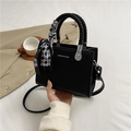 Black textured mini square bag with woven handle and geometric checkered scarf accent - Black