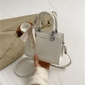 White square handbag with litchi texture and silk scarf decoration on woven handles - White