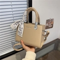 Beige litchi grain square handbag with woven handle and elegant silk scarf accessory - Khaki