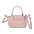 Rosa Mini-Flechtasche mit Lederklappe und abnehmbarem Schultergurt in sanfter Optik - Rosa