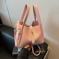 Pink lychee grain leather handbag with golden twist lock and adjustable shoulder strap - Pink