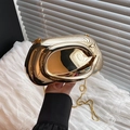 Artistic gold geometric clutch bag with C-shaped handle and wave texture for parties - Gold