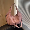 Minimalist dusky pink nylon tote bag with multiple pockets and adjustable shoulder strap - Pink